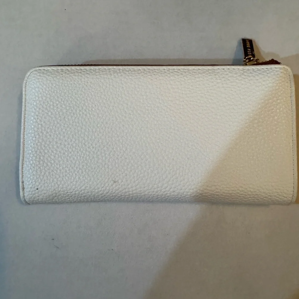Anne Klein AK Logo Slim Zip Around Wallet in a two-tone Cream and Brown/Saddle